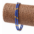 Tobillera fina nepalí de doble hilera con detalle de cuentas de lapislázuli y latón - (22 cm)
