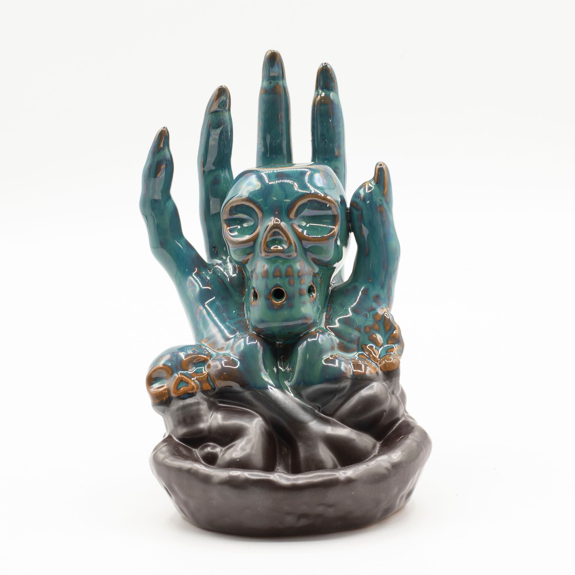 Quemador de incienso de flujo inverso - Calavera en la mano